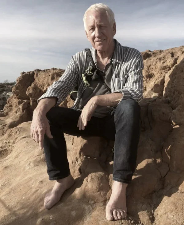 Clint Ober sitting on a rock image